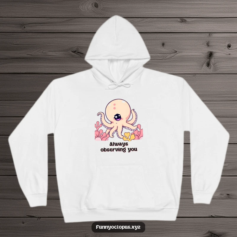 Funny hoodie featuring an octopus character with a twinkling eye, peeking mischievously from behind a coral reef.