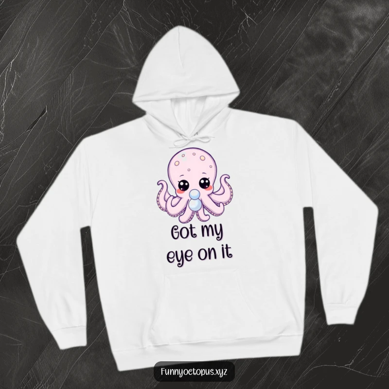 Funny hoodie featuring an octopus with large, expressive dot eyes, tentacles reaching for a shiny pearl.