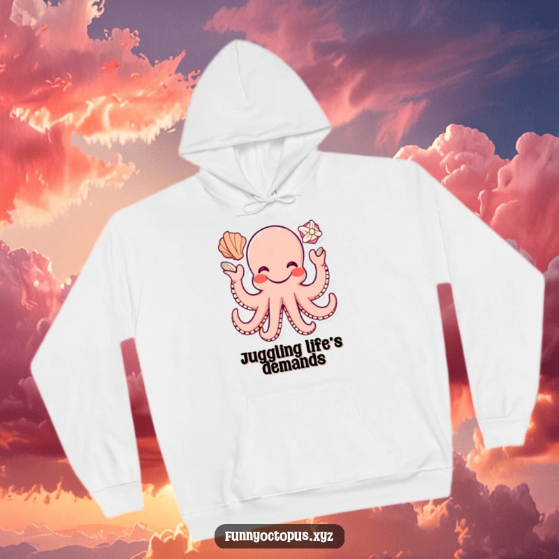 Funny hoodie featuring a happy octopus character with a wide grin, expertly juggling seashells with its tentacles.
